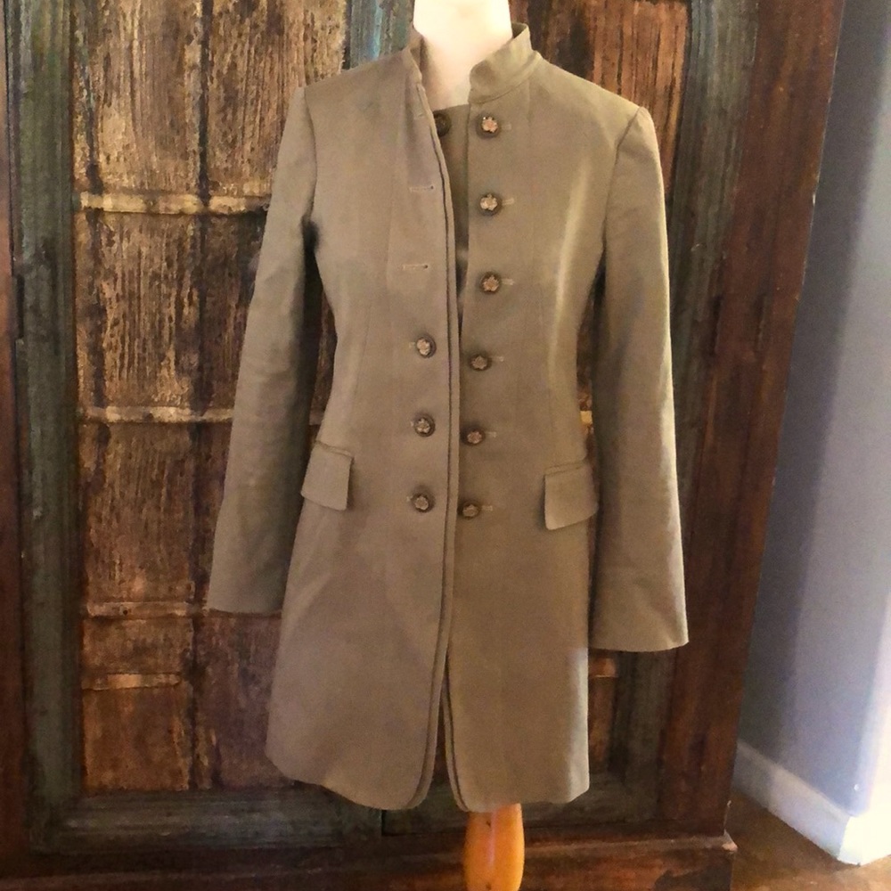 Long trench jacket with no collar. Never used.            33 Inches long